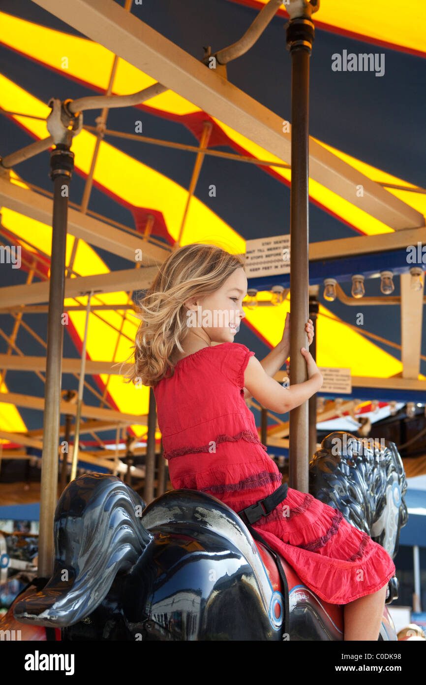 Little girl on carousel Stock Photo