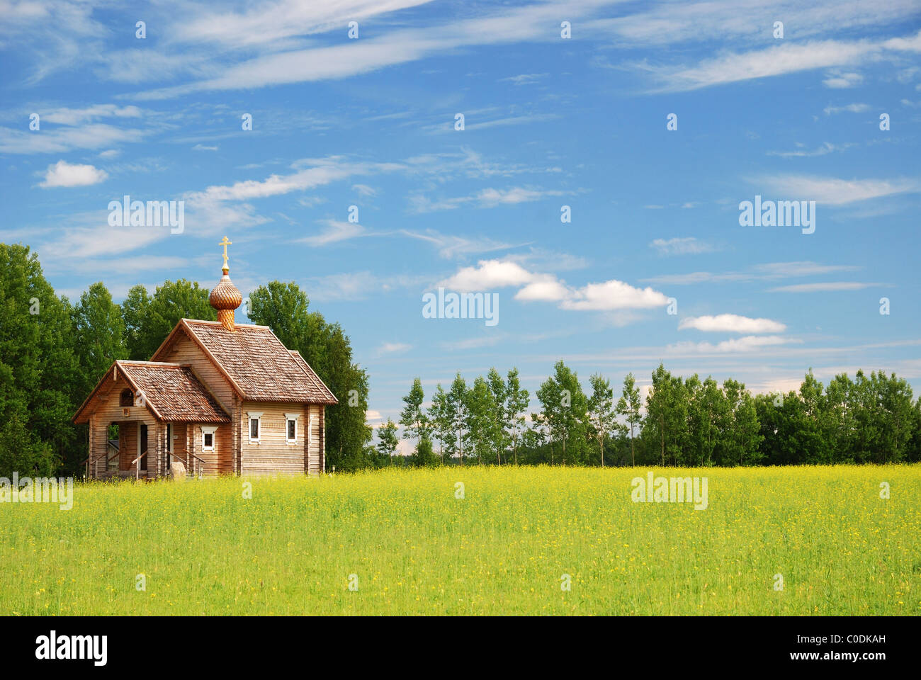 Rural landscape with small wooden church Stock Photo - Alamy