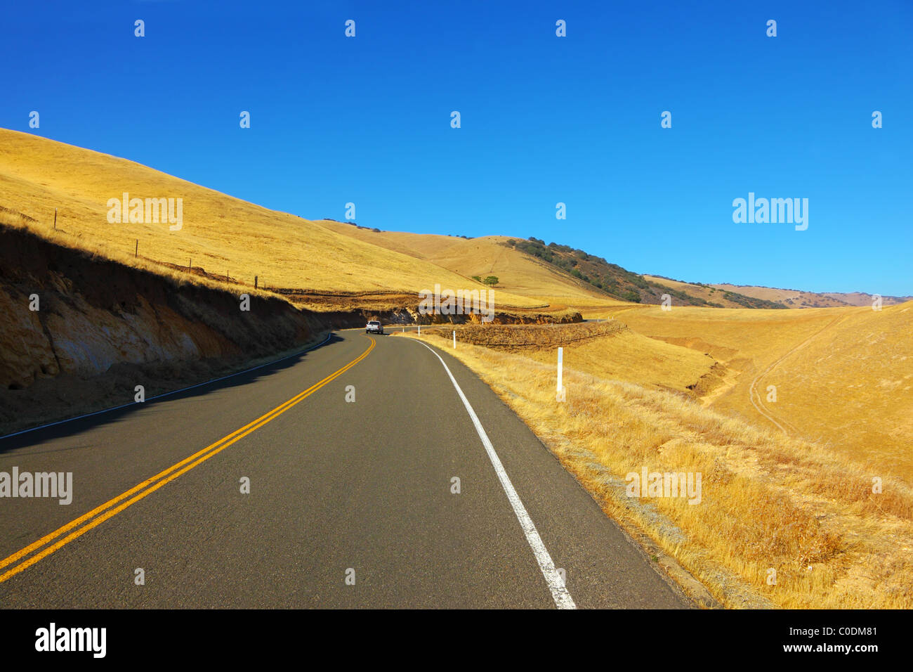 American roads. The magnificent American road passes between autumn hills of California Stock Photo