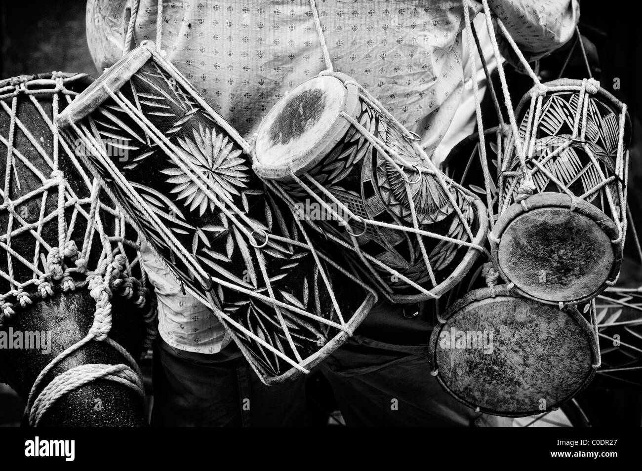 Indian drum seller on the street. Andhra Pradesh, India. Monochrome Stock Photo