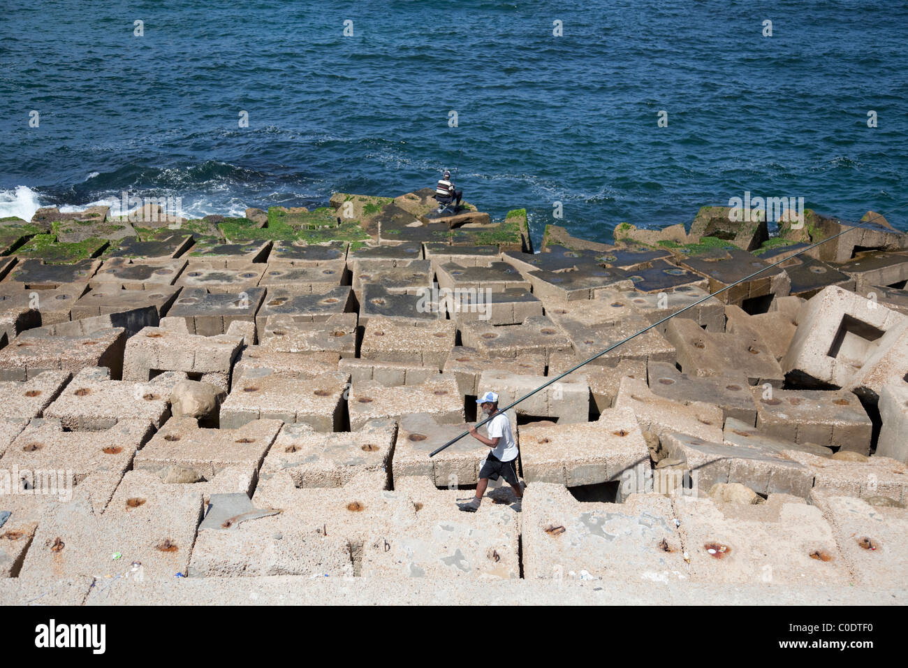 Fishermen by the seaside of Alexandria, north of Egypt. Stock Photo