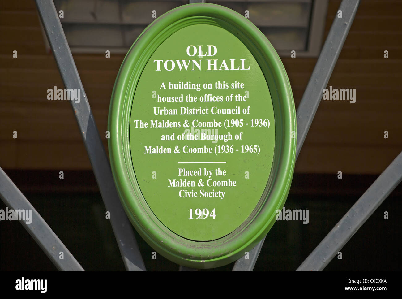 green plaque marking the site of a former town hall, in new malden, surrey, england Stock Photo
