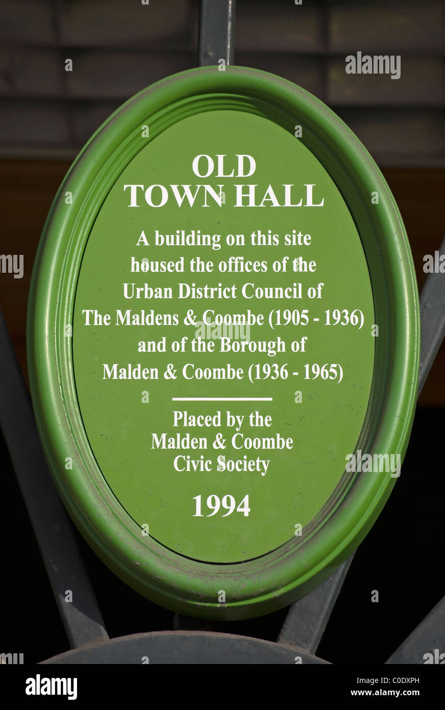 green plaque marking the site of a former town hall, in new malden, surrey, england Stock Photo