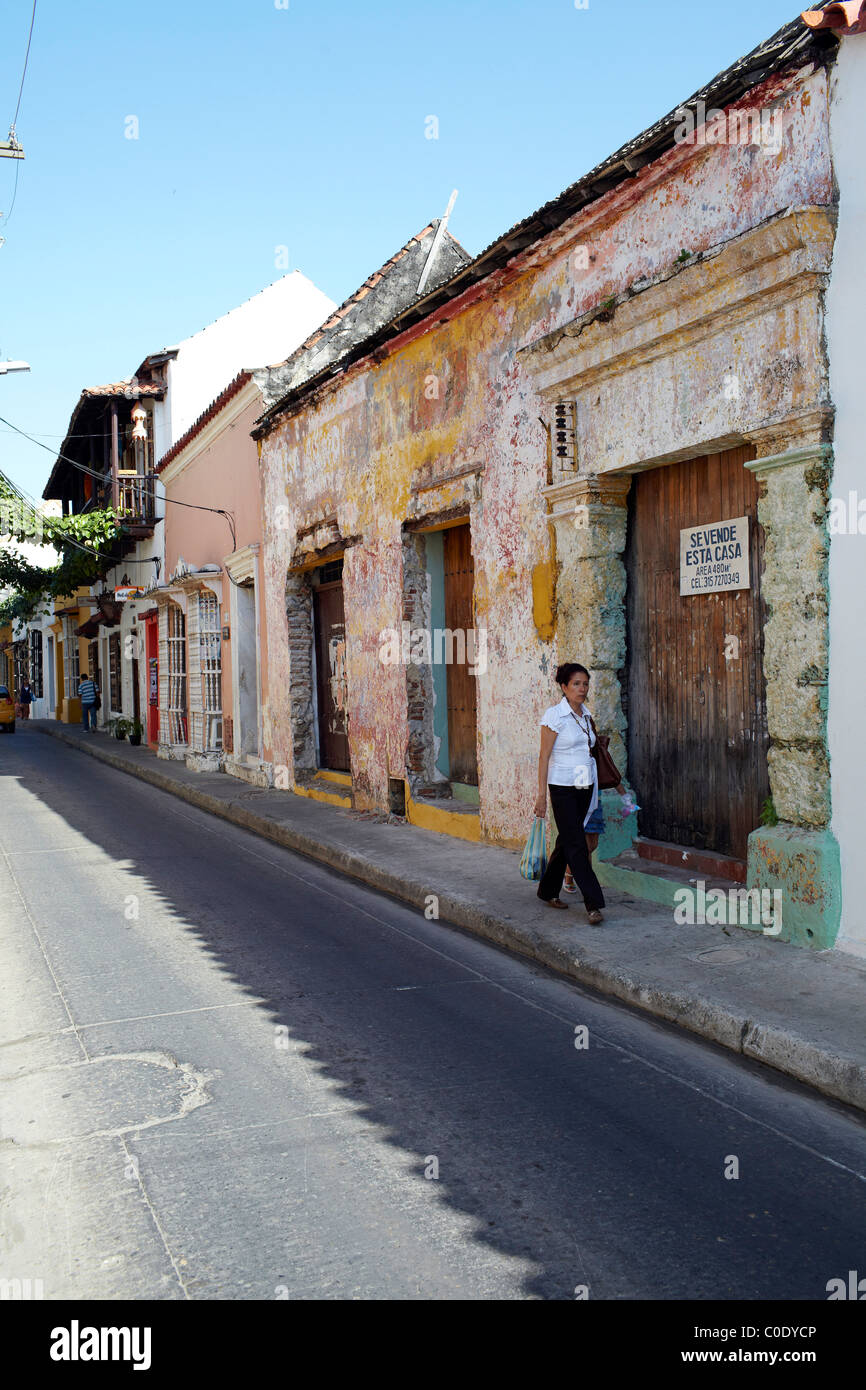 Old woman walking down street hi-res stock photography and images - Alamy