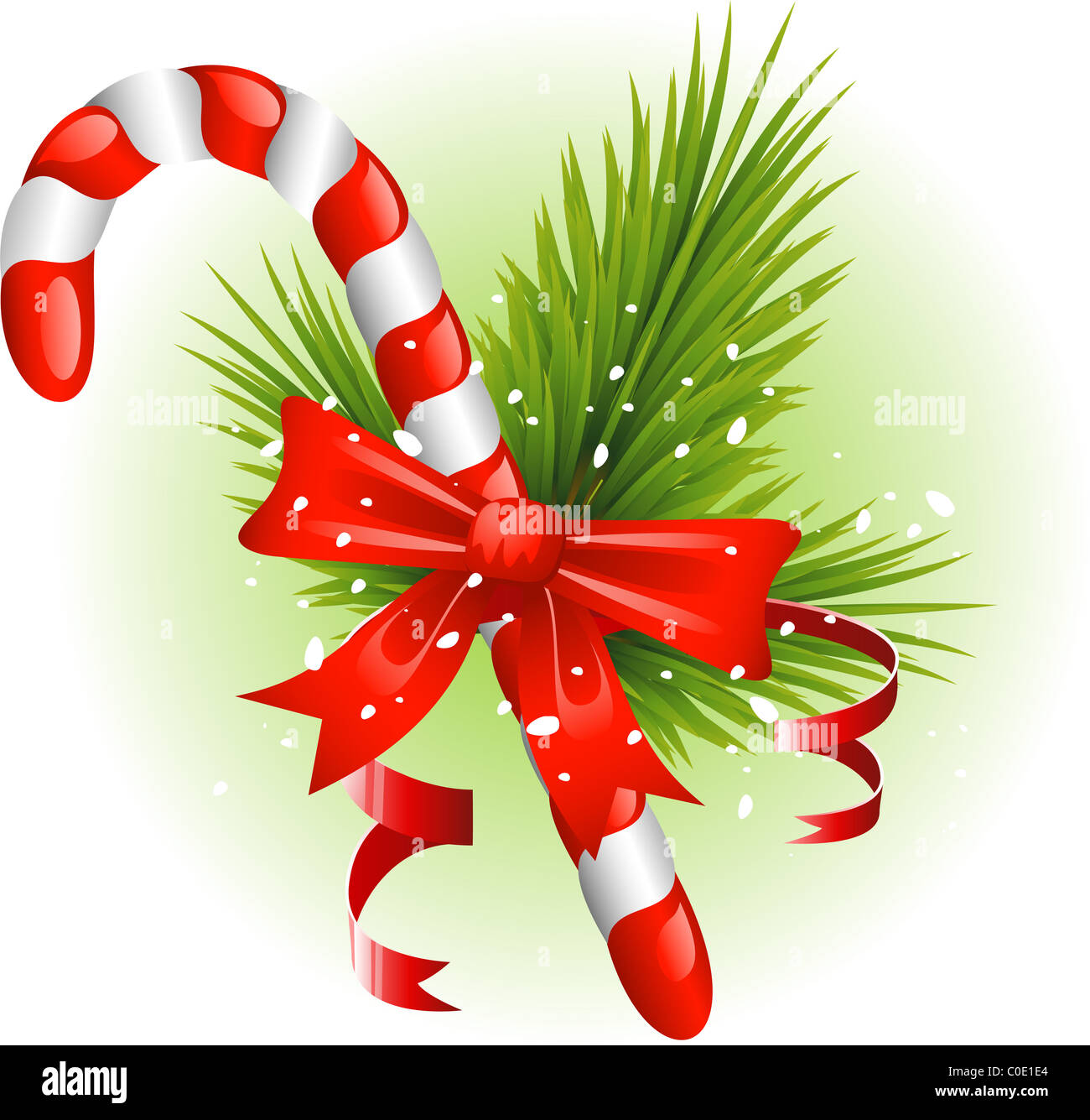 Christmas candy cane decorated with pine branches and a bow Stock Photo