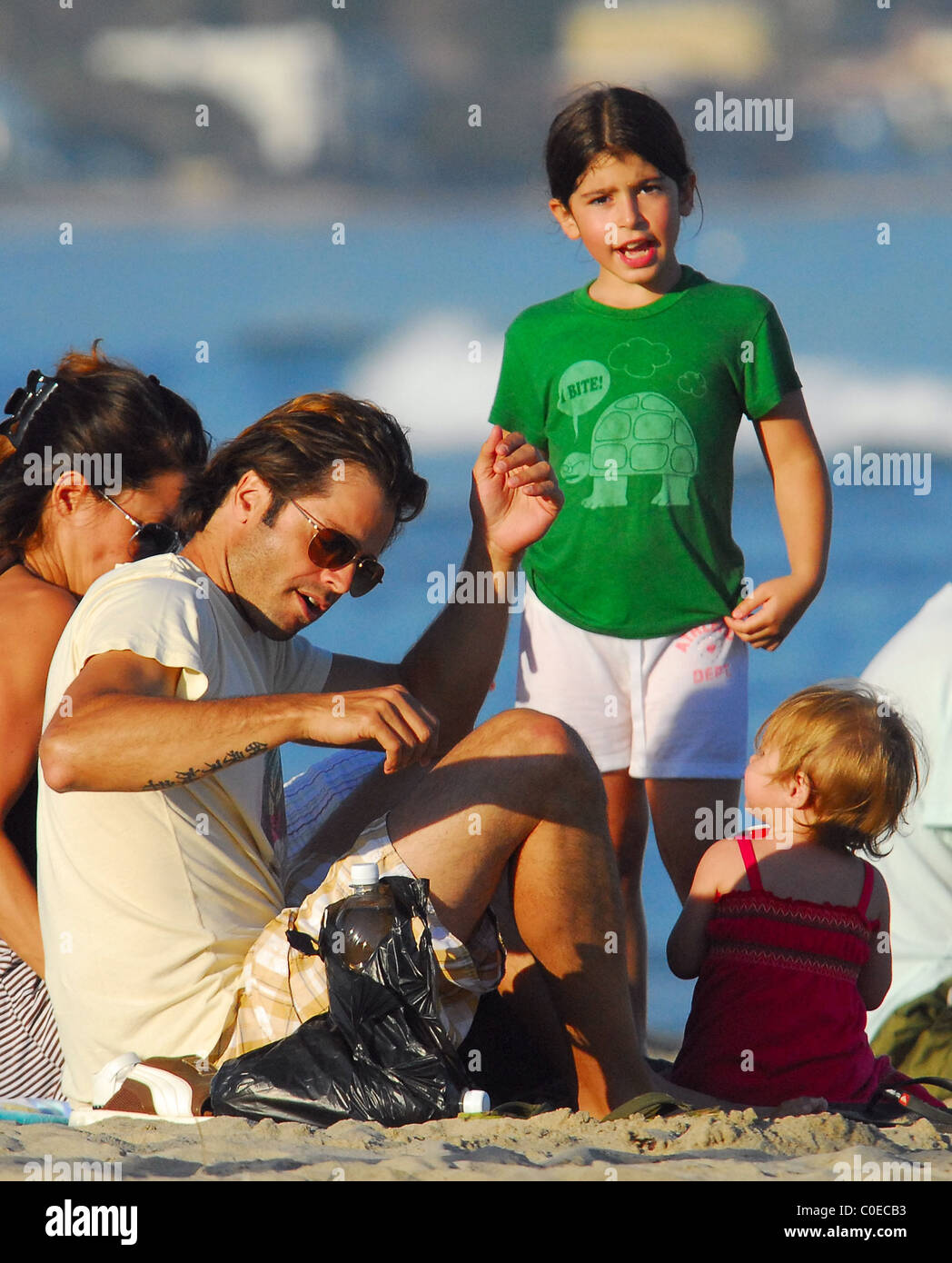 David Charvet with fiancee Brooke Burke and daughter Heaven Rain Charvet at Malibu Beach Malibu, California - 18.05.08 Stock Photo
