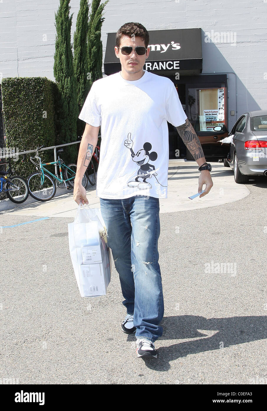 John Mayer wearing a Mickey Mouse print shirt, buys some camera equipment  at Samy's camera Los Angeles, California - 20.05.08 Stock Photo - Alamy