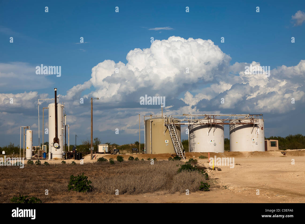 Oil storage tanks on site in Permian Basin oilfields Midland Texas USA Stock Photo