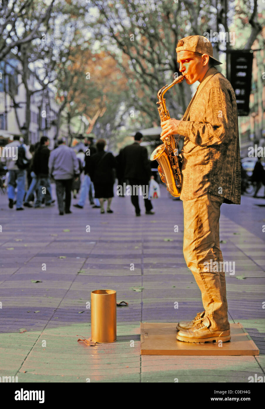 Barcelona, Spain. Gold saxophone-playing 'statue' in Las Ramblas Stock Photo