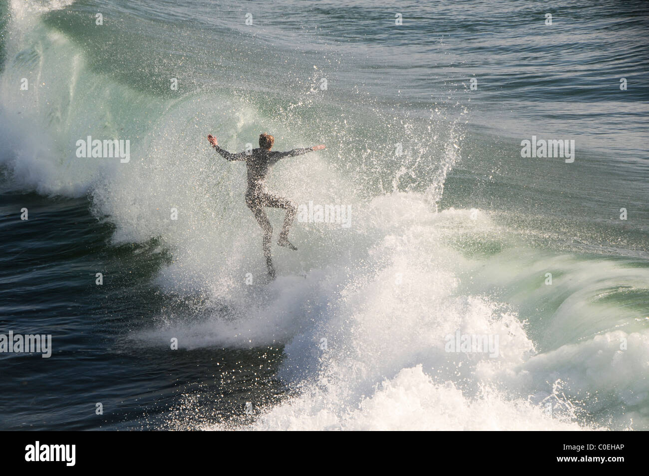 Surfer Catching Wave Stock Photo Alamy