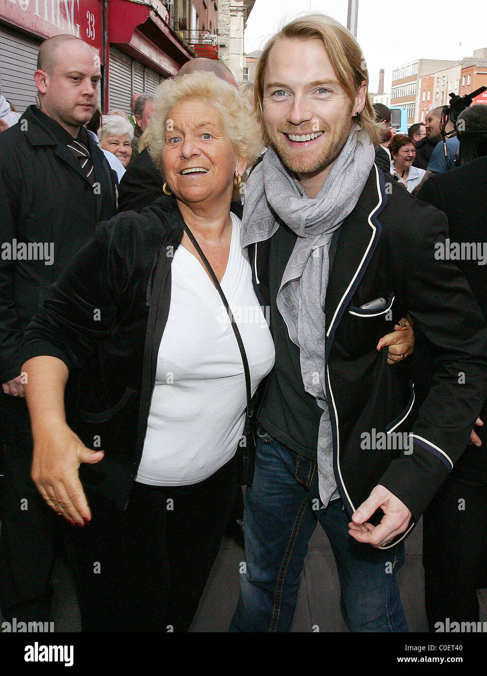 Ronan Keating of Boyzone jokes with a fan at the opening of Keith Duffy's father's shop 'Plus and Minors' Dublin, Ireland Stock Photo - Alamy