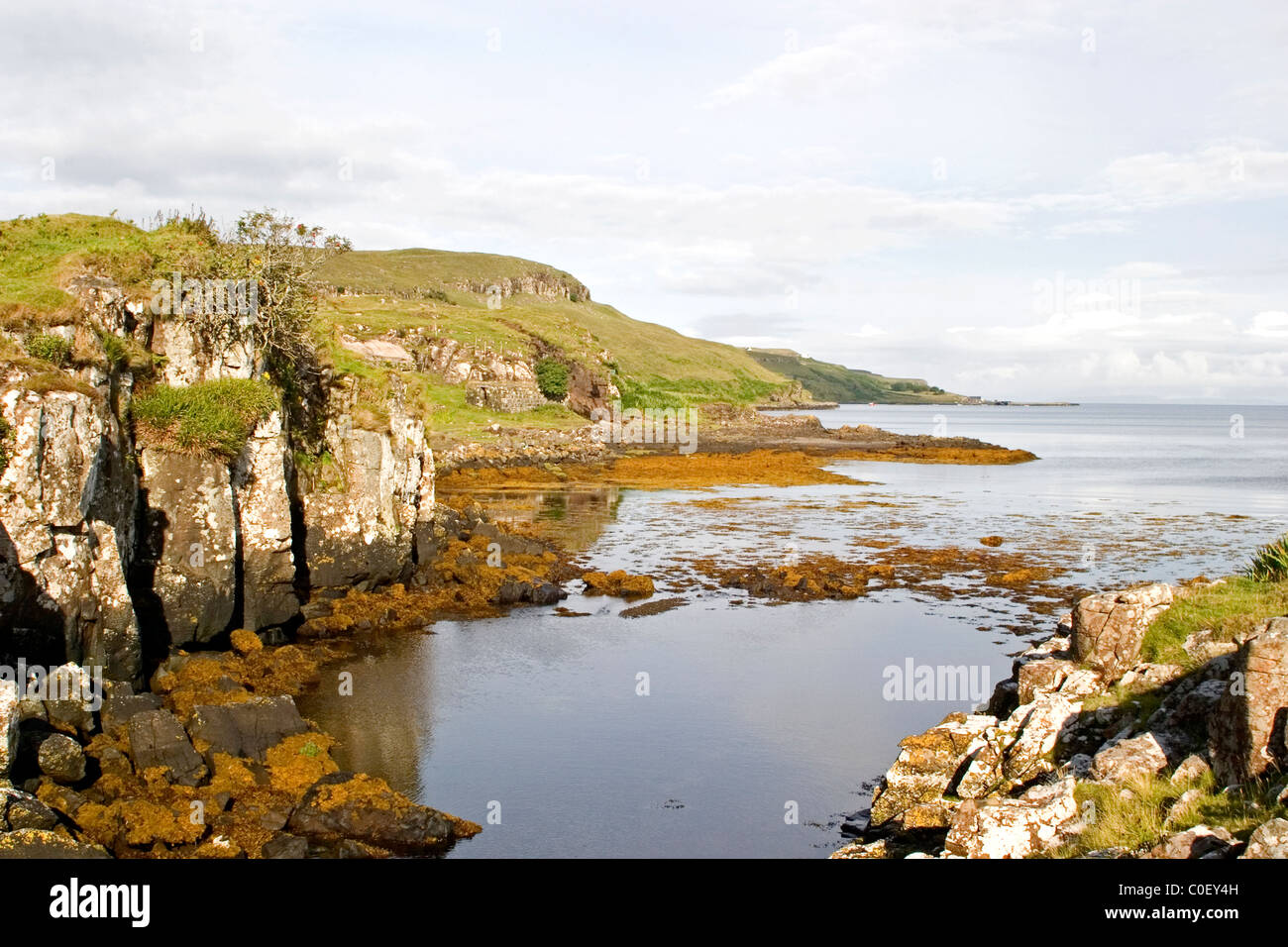 'Loch Pooltiel' 'Isle of Skye' calm ocean sea Scotland rocky shoreline moss tranquil scene tourist destination Stock Photo