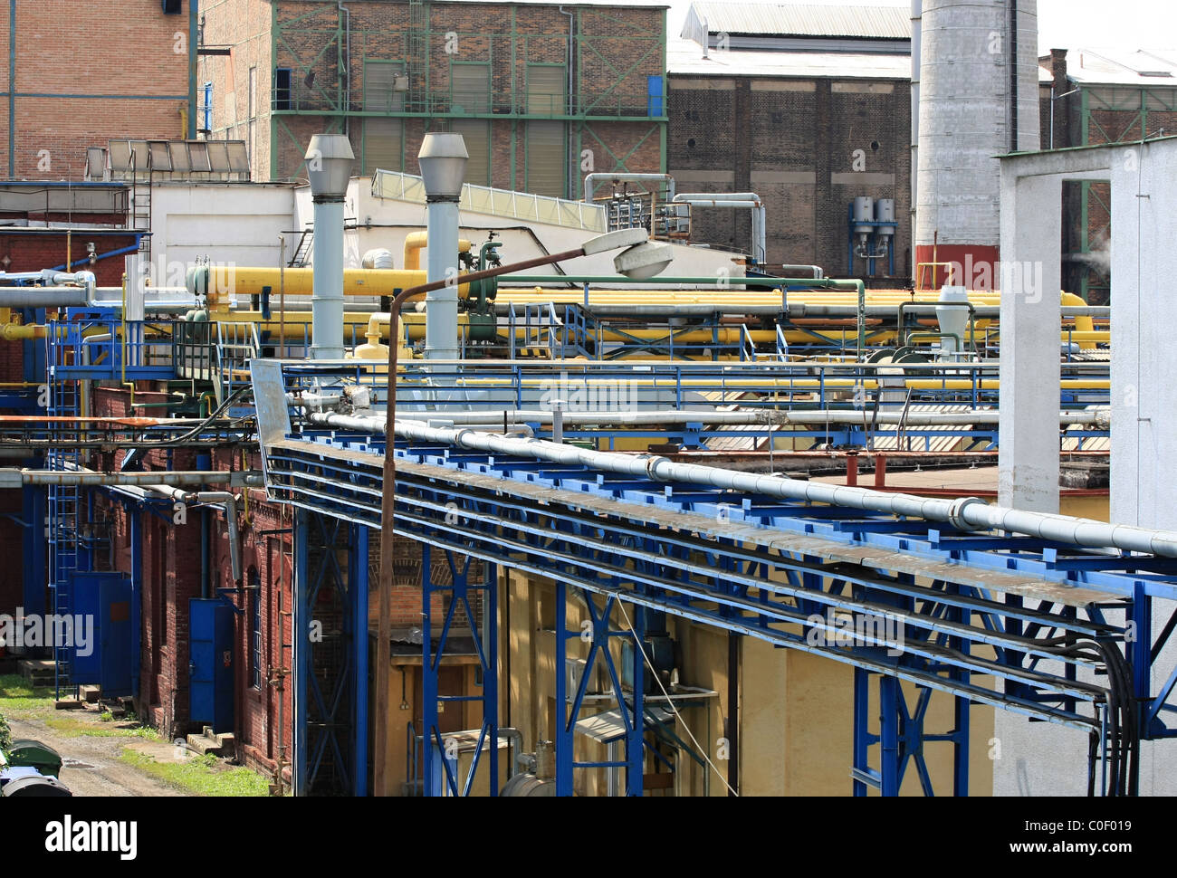 Tubes and chimneys at a chemical factory Stock Photo