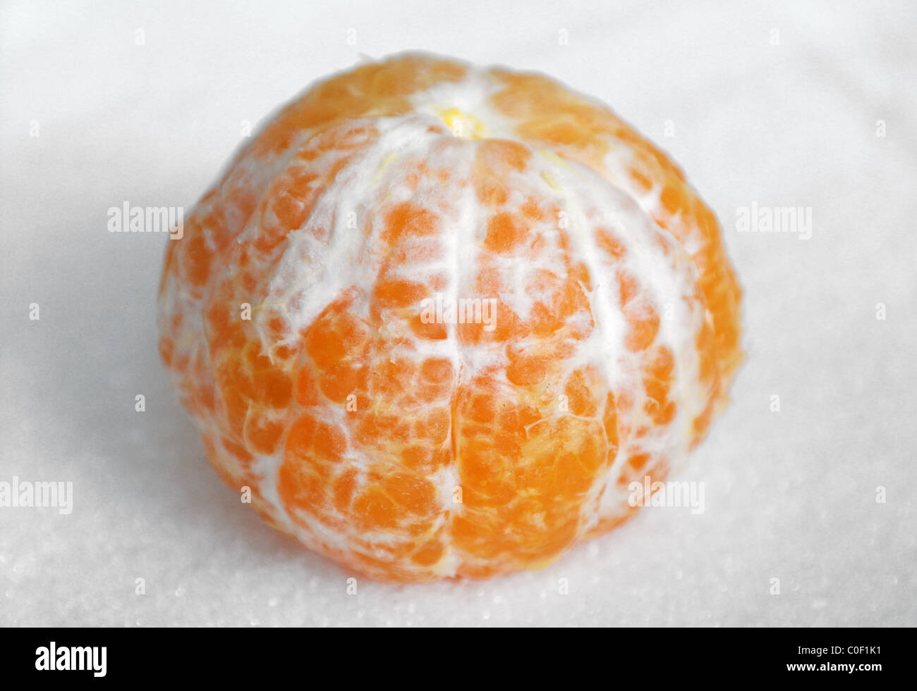 The cleared tangerine on granulated sugar Stock Photo