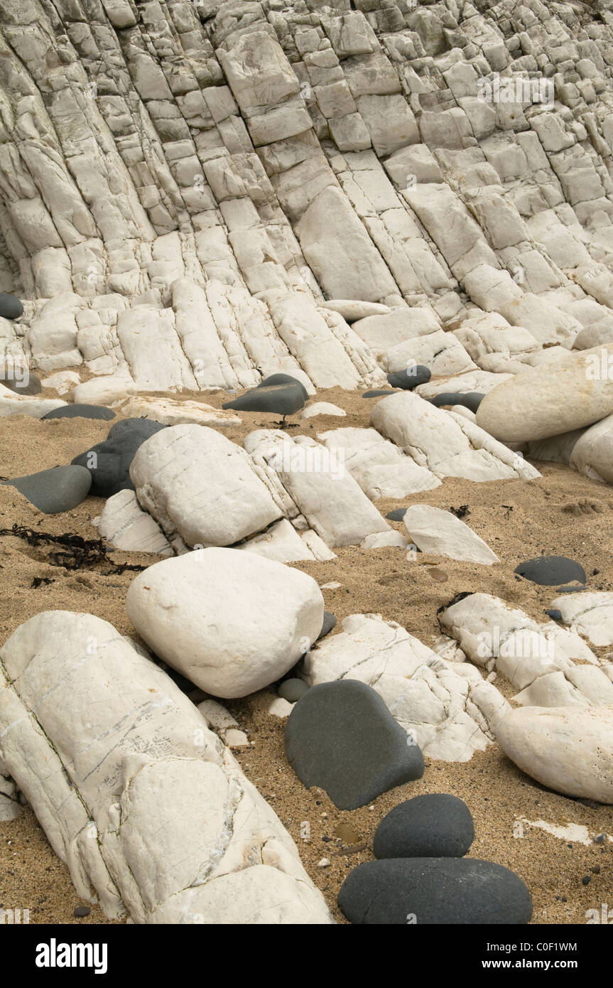 Vertical strata in cliffs on the beach directly below the lighthouse at