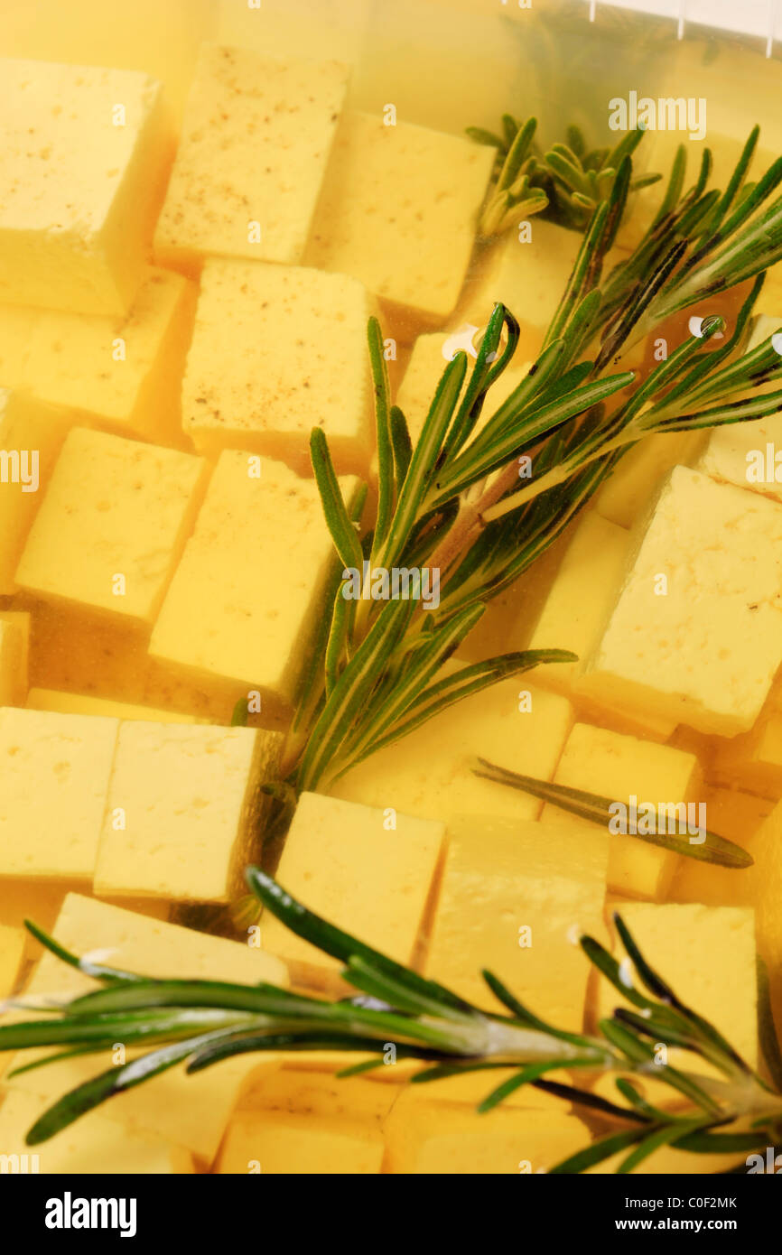 Feta cheese marinated in olive oil with pepper and rosemary Stock Photo Alamy