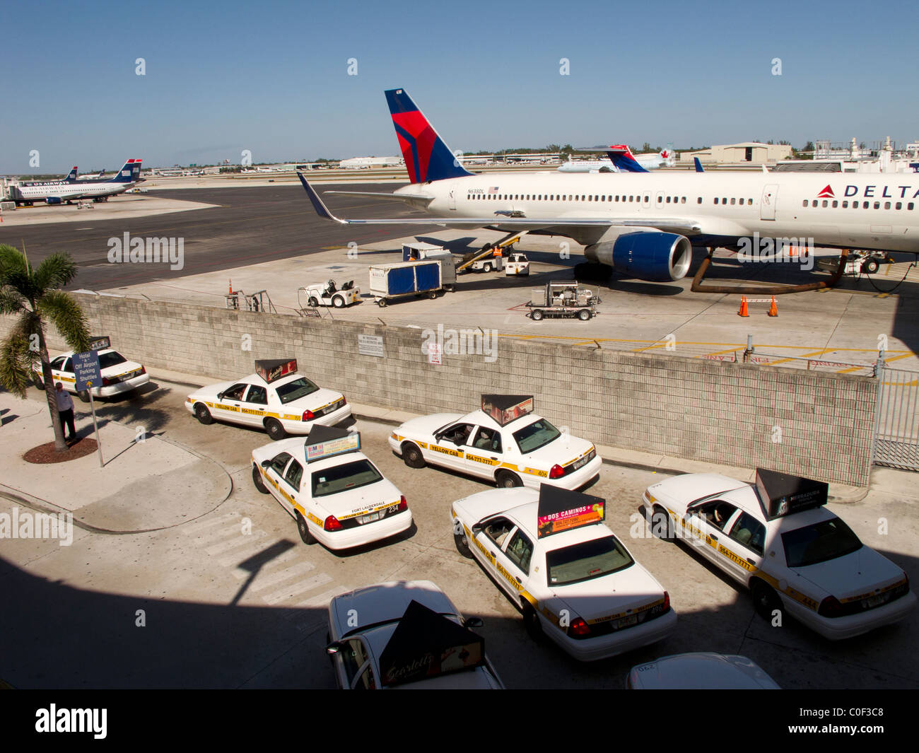Taxis lining up at airport arrivals. Stock Photo