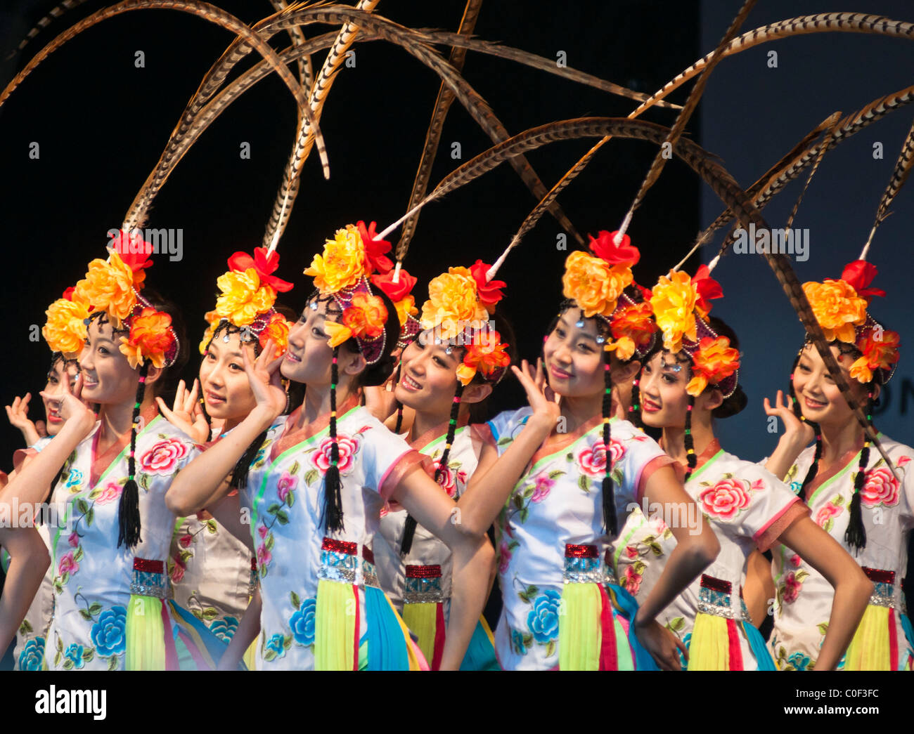 Chinese dancing girls at the New Years celebrations (year of the Rabbit), at Trafalgar square, London, UK Stock Photo
