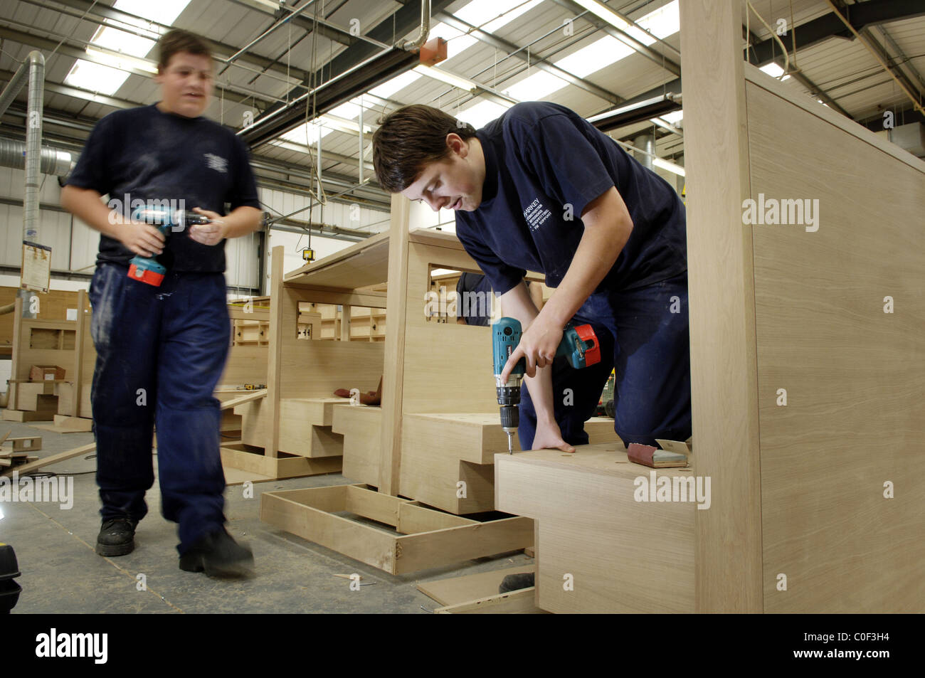apprentice joiners working in factory Stock Photo Alamy