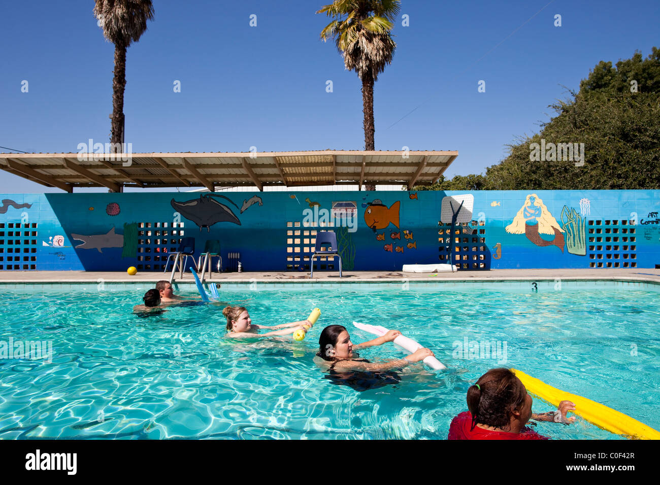 Reedley, California, United States.  Obese teenagers swim across the pool at Wellspring Academy. Stock Photo