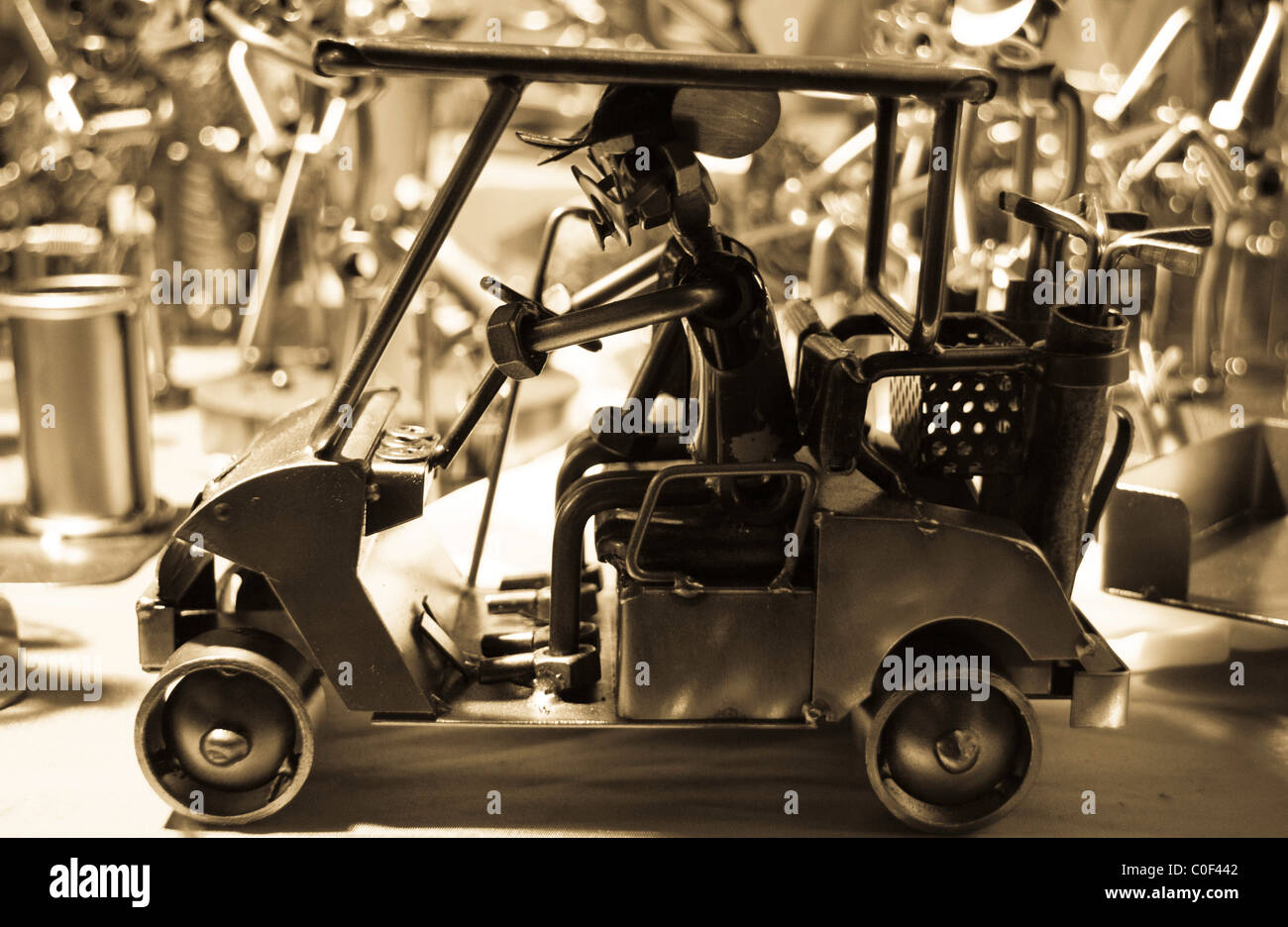 Model of golf cart and driver with clubs at the Birmingham German