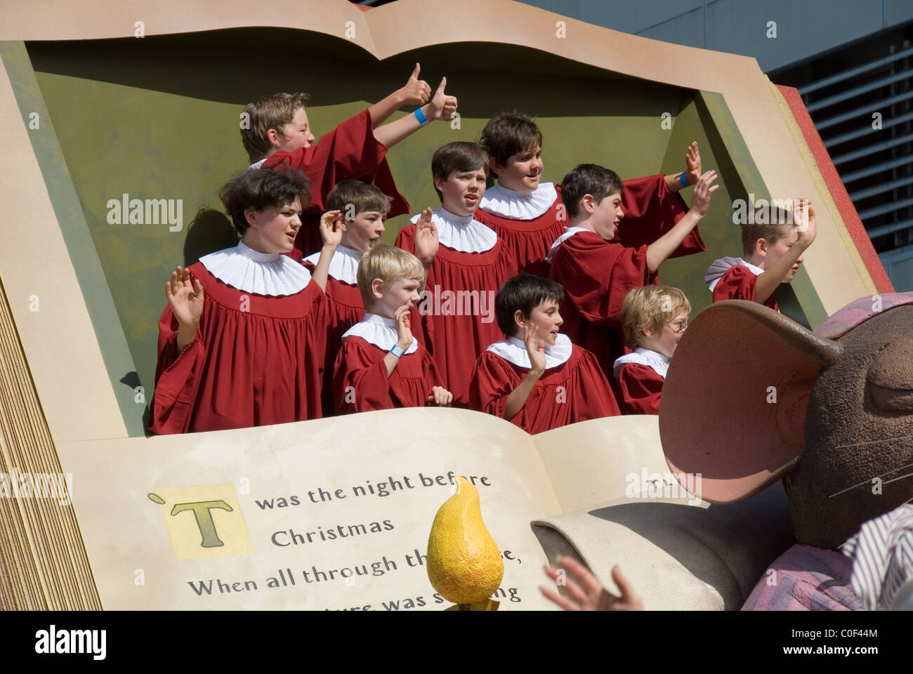 Carol singers book float in the Credit Union Christmas Pageant through the streets of Adelaide, South Australia. Stock Photo