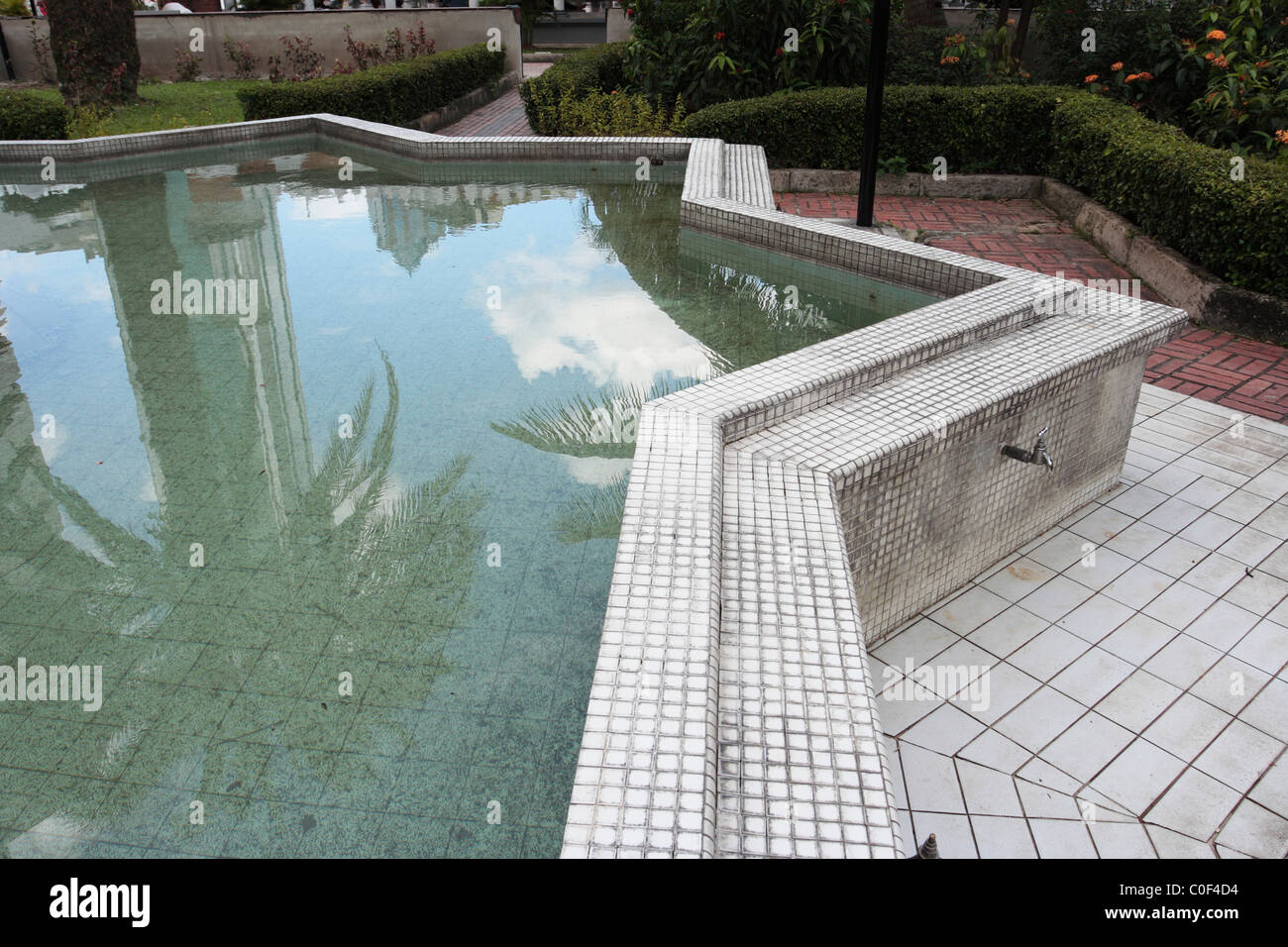 Abulation pool at Jamek Mosque in Kuala Lumpur, Malaysia Stock Photo ...