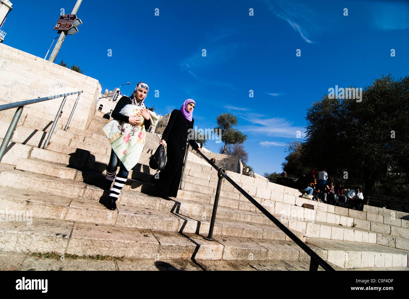 A Palestinian women walking down towards Damascus gate in east