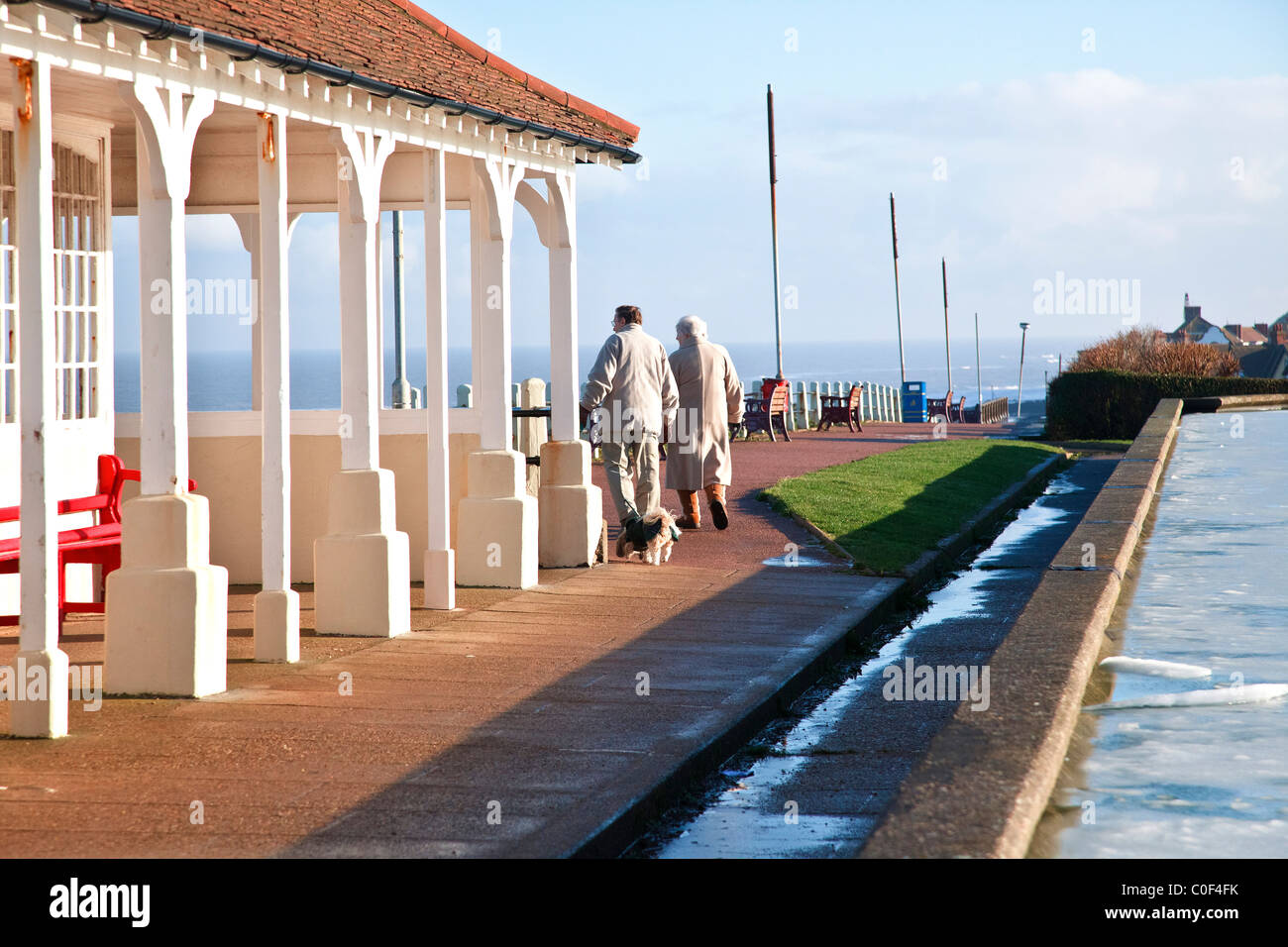 Walking the dog along Sheringham promenade cliff walk "North Norfolk