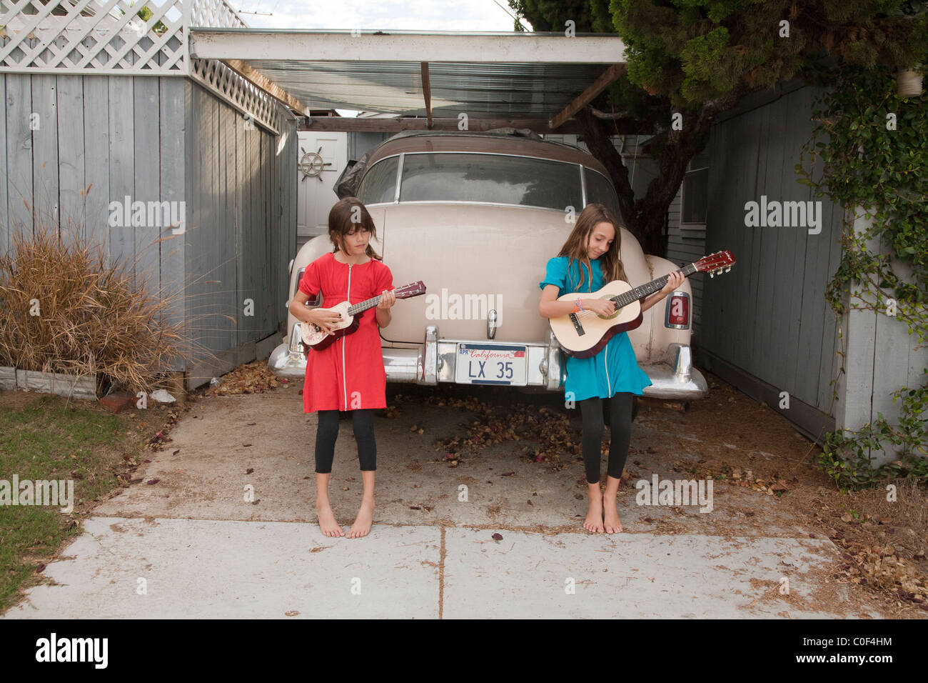 Girls playing with guitars Stock Photo
