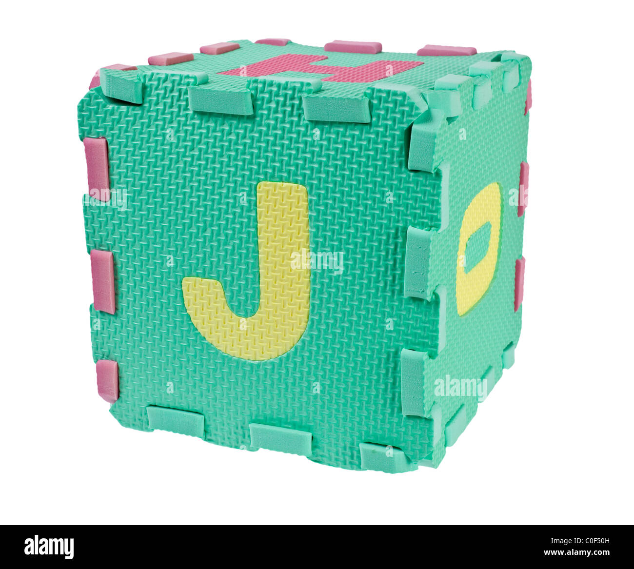 Toy blocks forming a cube with the letter J isolated on white