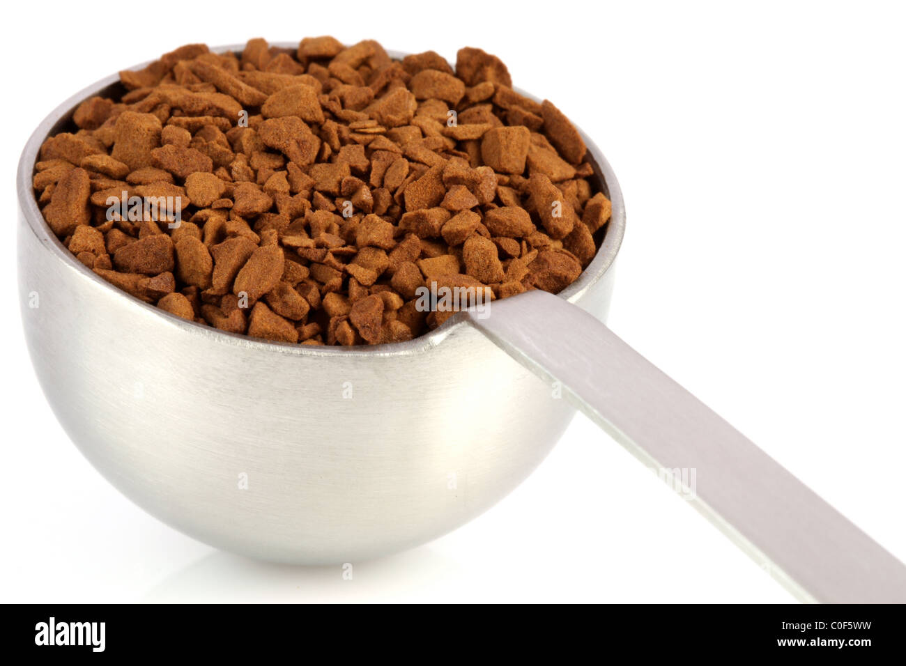 fresh instant gourmet coffee scoop isolated against white background
