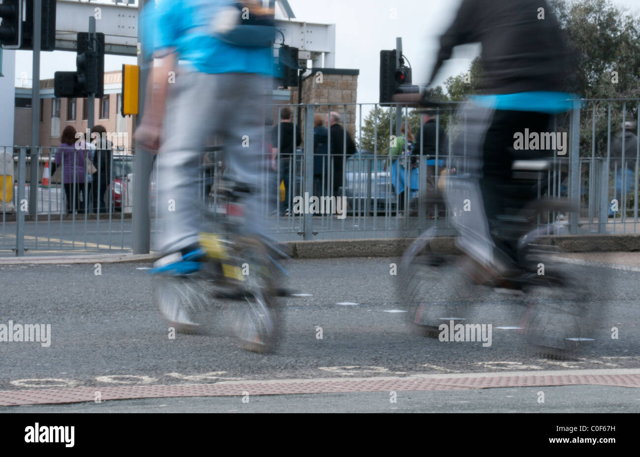Teenagers on Bicycles using Pedestrian Crossing Stock Photo Alamy