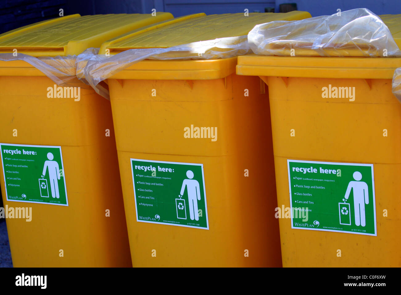 Yellow wheelie bins hi-res stock photography and images - Alamy