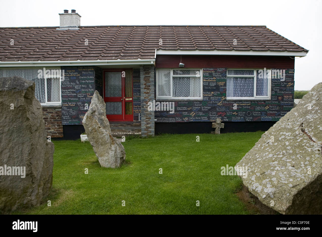 The home of Cornish Druid Ed Prynn at St Merryn where slate plaques with tributes to famous people cover the walls. Stock Photo