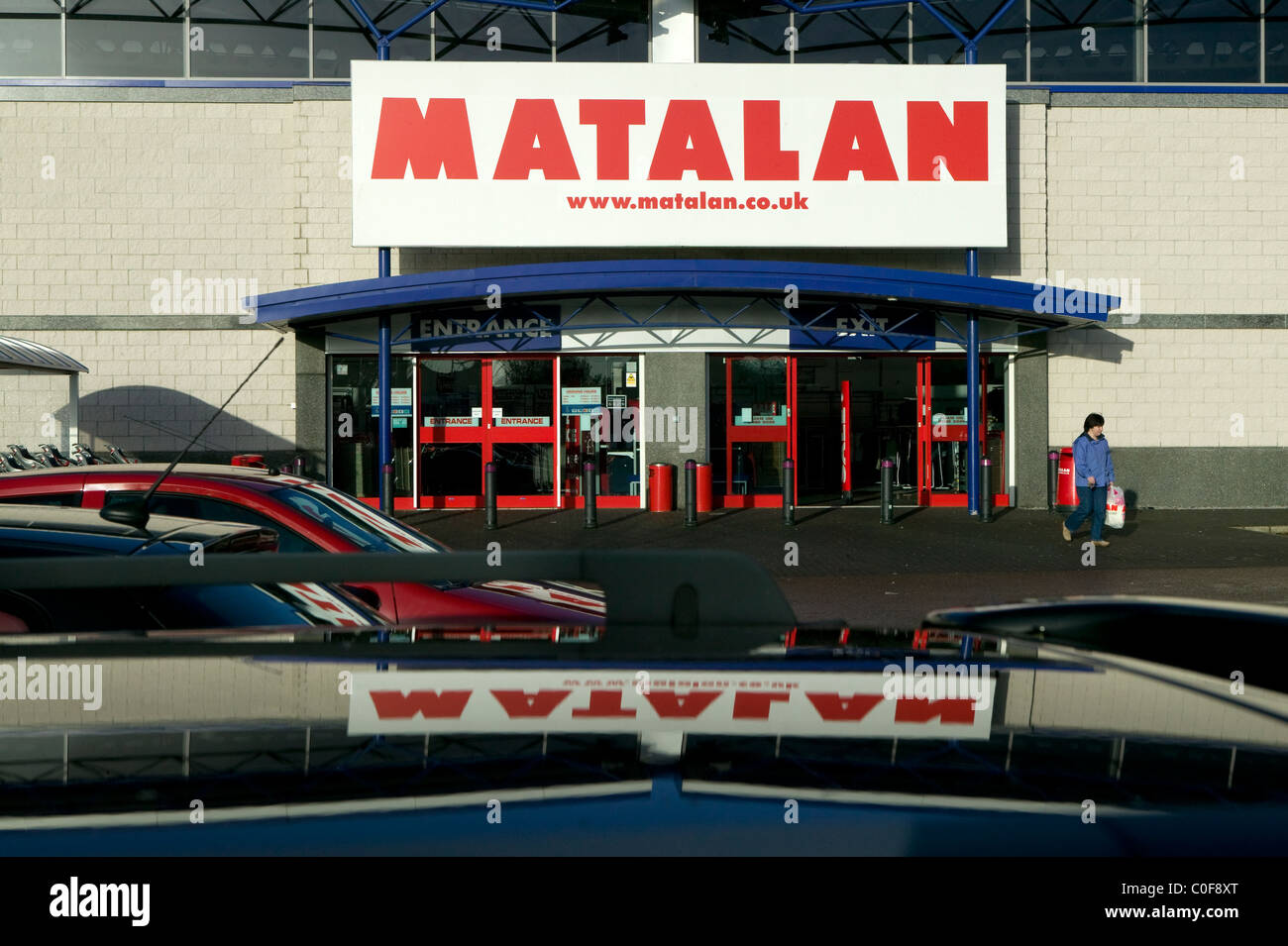 Matalan retail store reflected in car roof Stock Photo Alamy