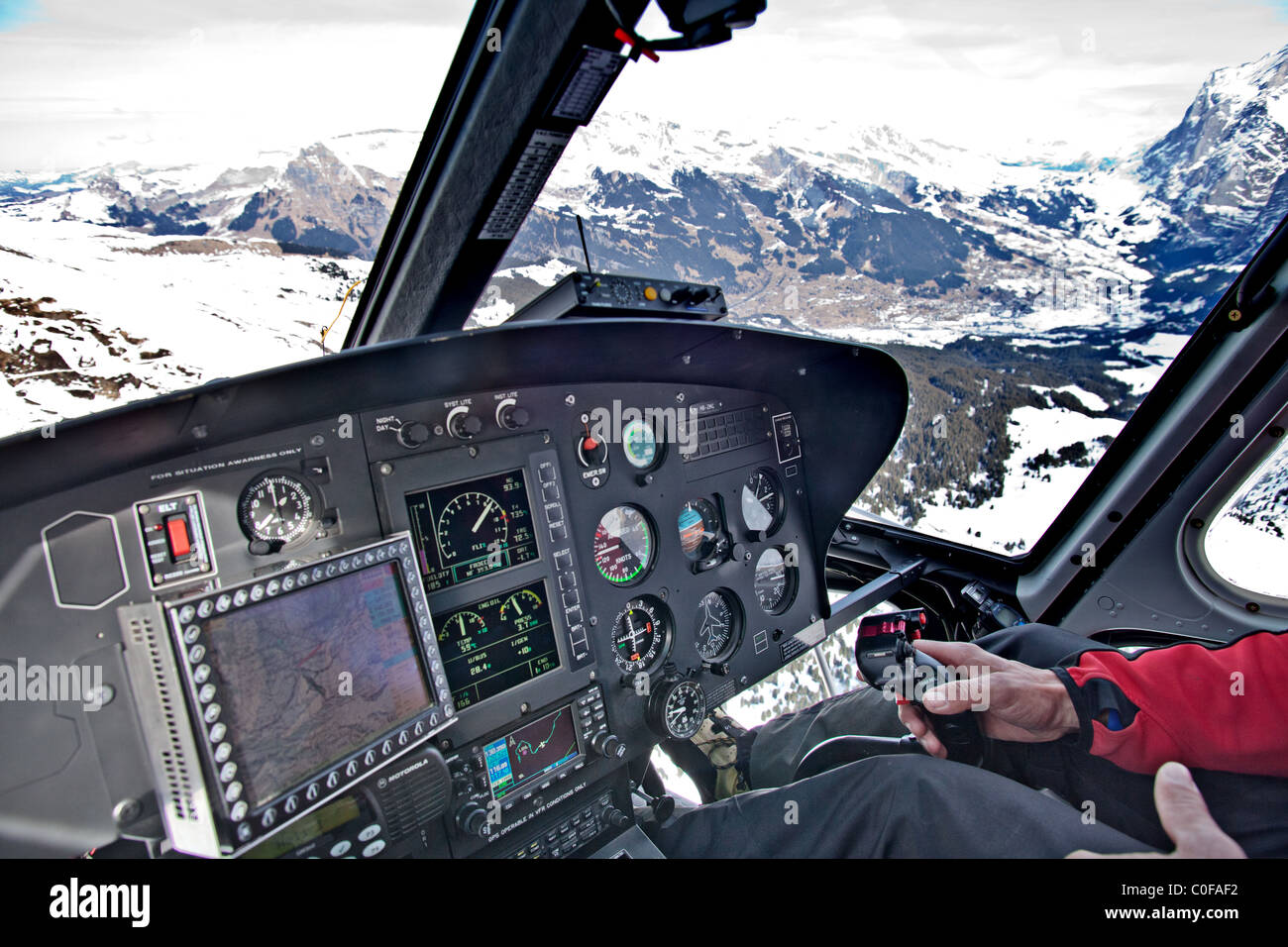 Flying in a helicopter over Alps, Grindelwald, Bernese Oberland, Switerland Stock Photo