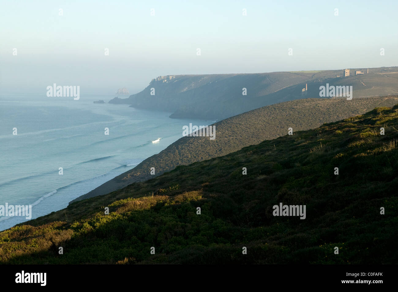 View along the north Cornwall Coast with Wheal Coates tin mine in the distance Stock Photo