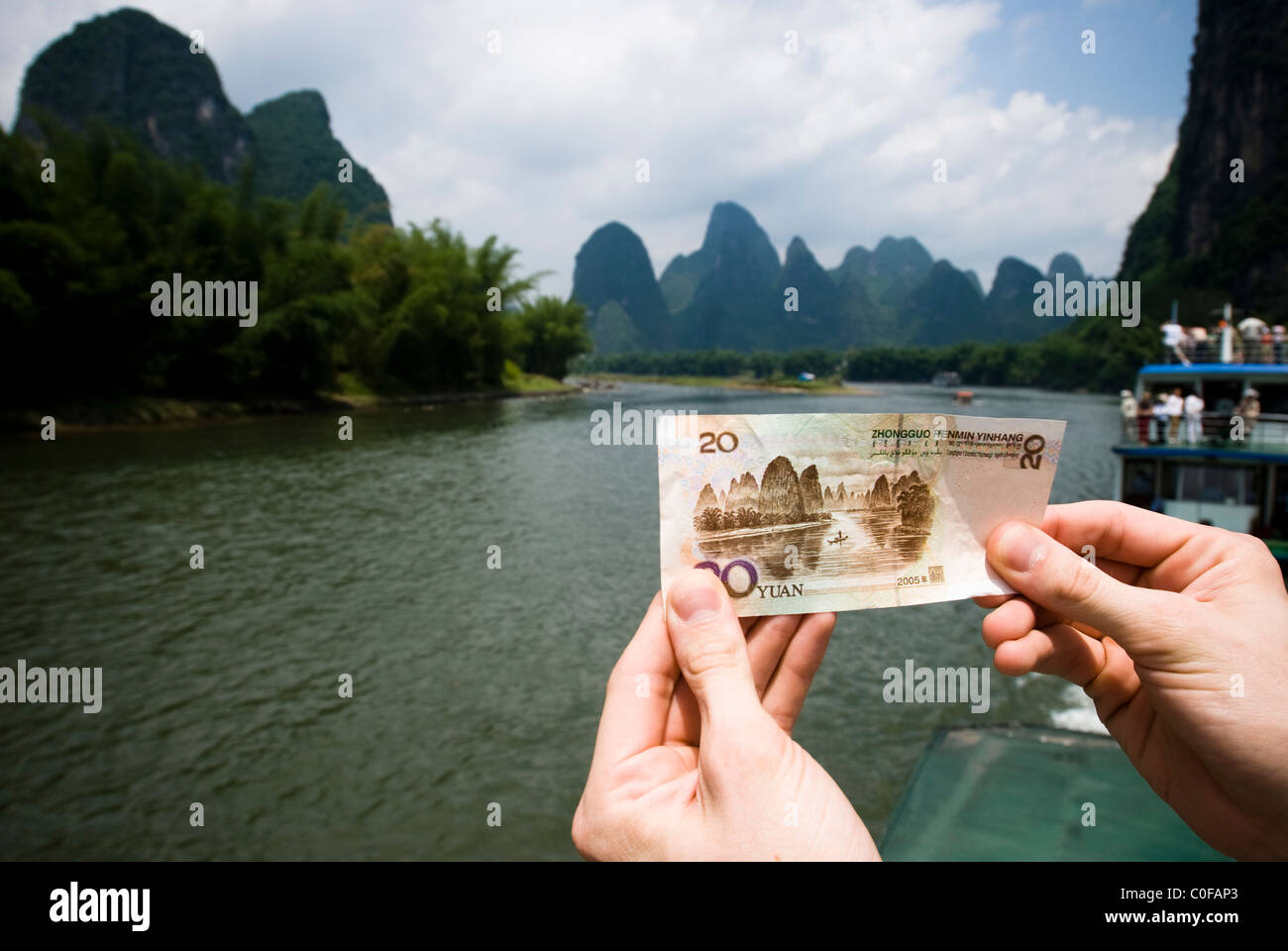 picture of 20 Yuan note taken while passing the very karst formation that is featuring on the note itself Stock Photo