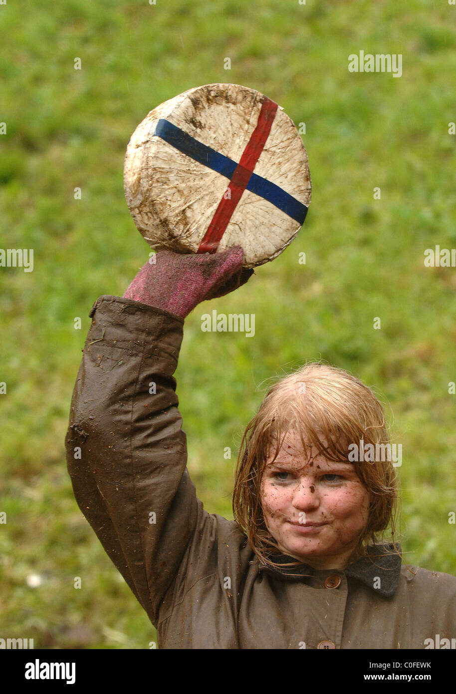 The winner of the women's race Competitors chase a Double Gloucester