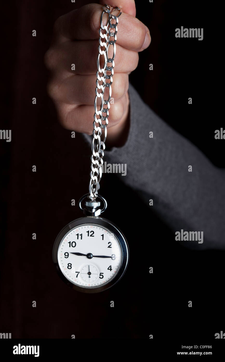 pocket watch on a chain-hypnotherapy Stock Photo