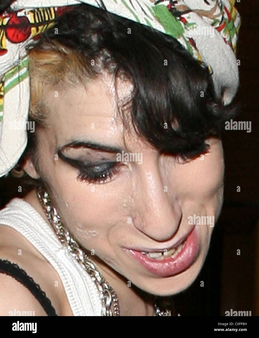Amy Winehouse throws out some rubbish, having indulged in a spot of ...
