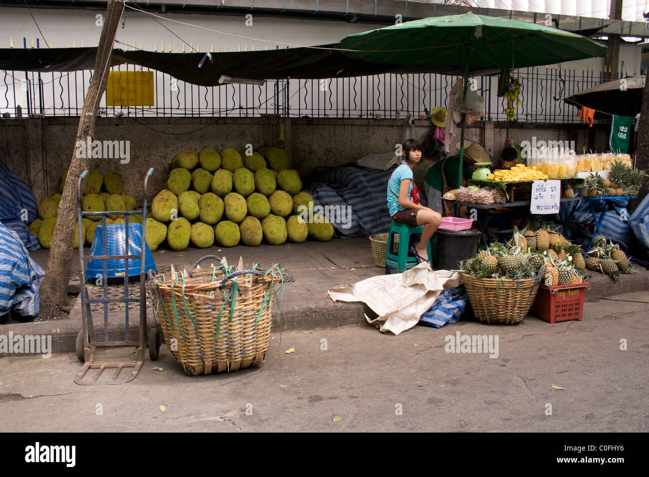 Jak fruit stacked at a street market in Bangkok, Thailand. Stock Photo