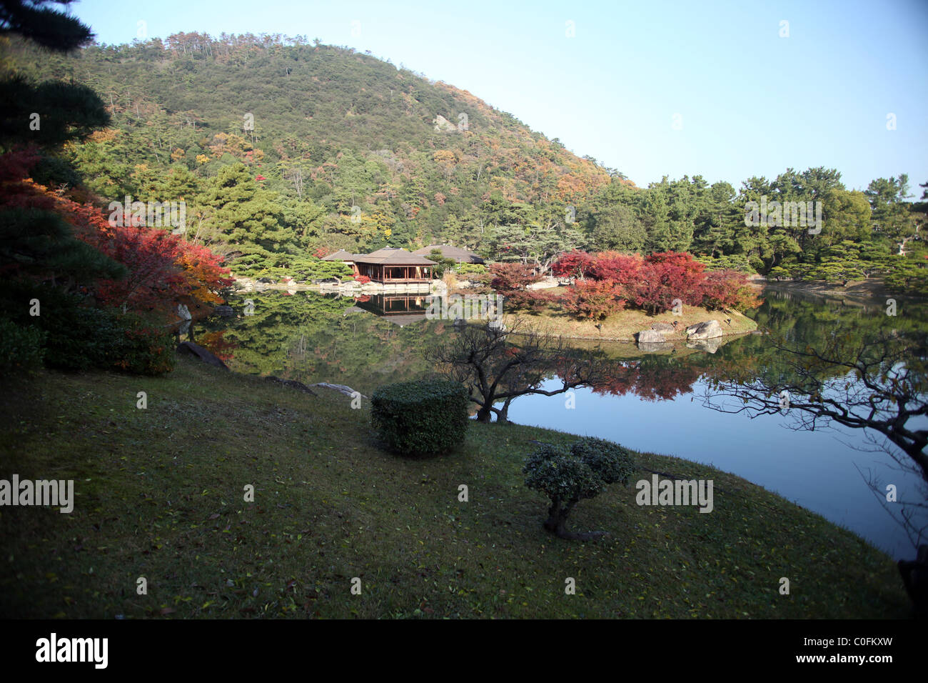 View of lake and teahouse at Ritsurin Koen gardens, Takamatsu, Shikoku, Japan. Stock Photo