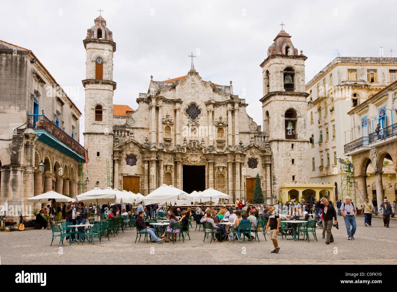 People eating an drinking in the Cathedral square Havana Cuba Stock Photo