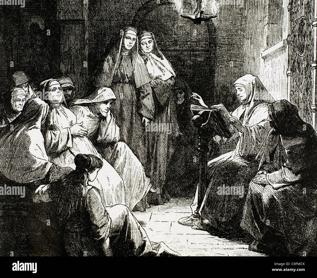 Cloistered nuns. Gospel reading. 19th-century engraving. Stock Photo
