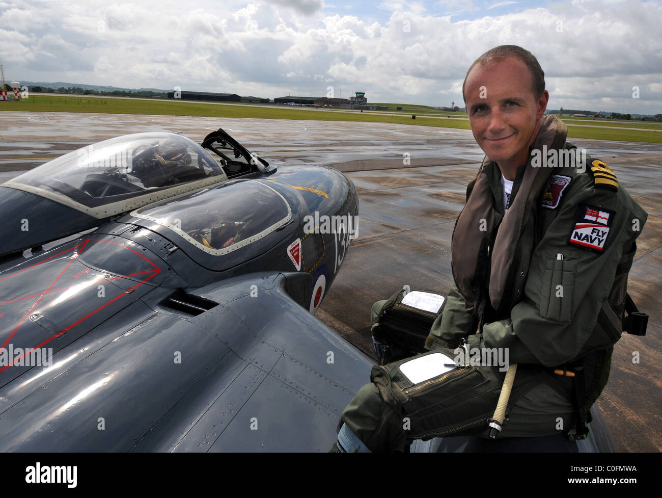 Lt Cdr Matt Whitfield who flies a Sea Vixen sitting with the de Havilland DH.110 Sea Vixen Stock Photo