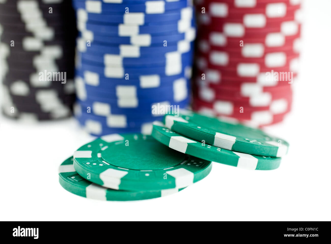 multicolor poker chips heaps isolated on white background. closeup