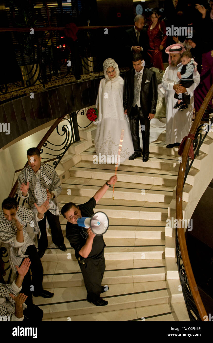A Jordanian bride and groom on their way to a wedding ceremony in a hotel in Amman Jordan Stock Photo