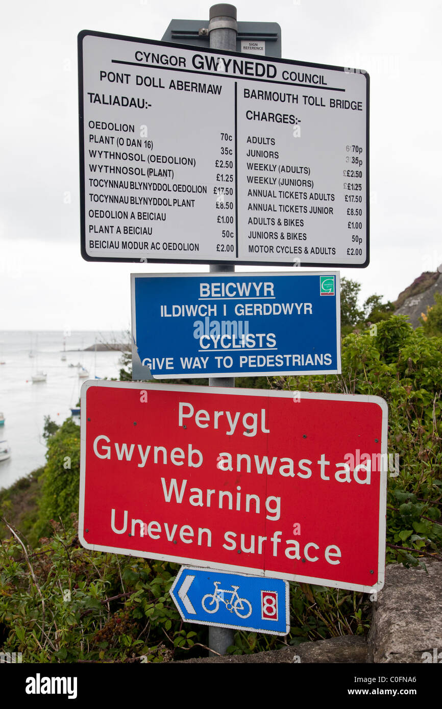 Bilingual signs relating to the Barmouth Toll Bridge, Wales Stock Photo
